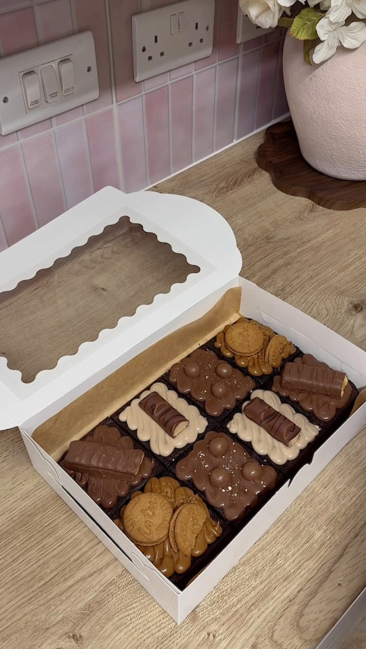 A brownie and cookie box being packed